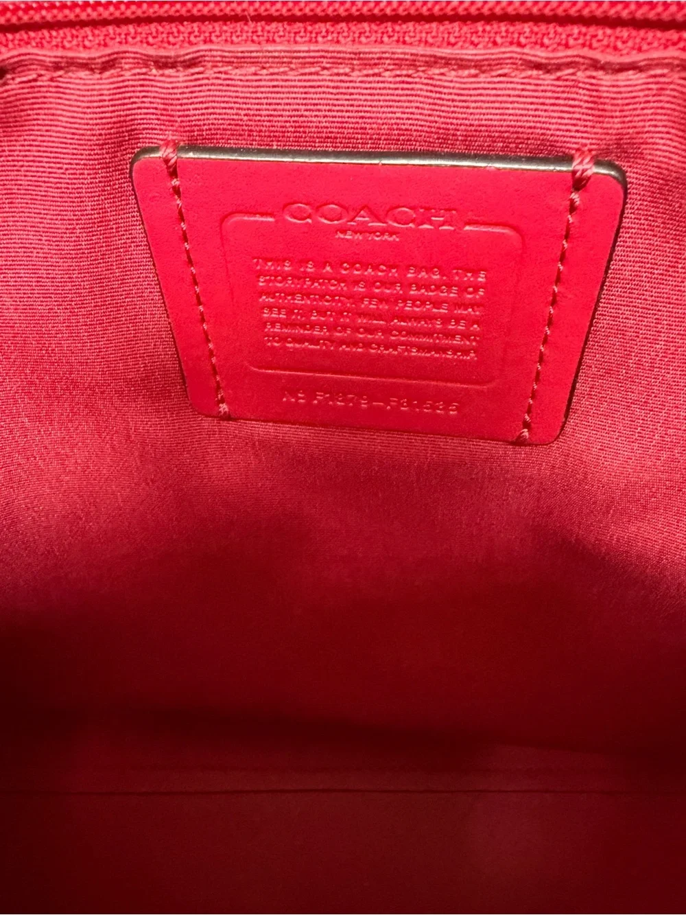 COACH Black Leather Tote Bag with Red Interior and Orange Tassel